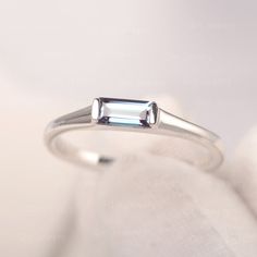 It is a graceful baguette shape alexandrite ring in sterling silver(925). Personalized is available, feel free to contact me. ❉Ring Features Center Stone: Lab Alexandrite Center Stone Cut: Baguette cut 3*6mm Metal type: 925 Solid Sliver/14K White Gold/14K Rose Gold ❉Production time: All jewelry are handmade by me. Please allow 8~10 working days to make your piece after placed the order. ❉Made to Order Add engraving free of charge Different metal, gemstones or shapes available Personalization req Solitaire Bands, Ring Baguette, Pear Cut Engagement Rings, June Birthstone Ring, Alexandrite Ring, Promise Rings For Her, Anniversary Gifts For Wife, Rose Gold Engagement, Ring Color