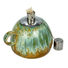 a tea pot with a chain around it