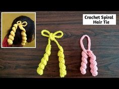 three crochet spiral hair ties on top of a wooden table next to an image of