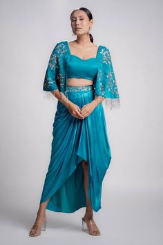 Azure blue padded blouse with sequin and cutdana embroidered cape-style sleeves. Paired with a draped skirt. - Aza Fashions Sequin Cape, Embroidered Cape, Padded Blouse, Cape Style, Draped Skirt, Cape Sleeves, Azure Blue, Fashion App, Blue Satin