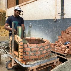 a man is making bricks in a brick kiln