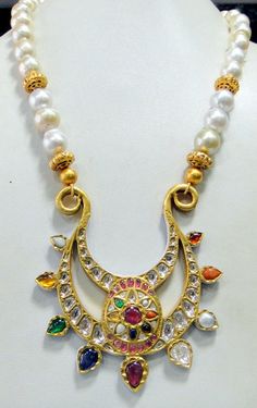 Vintage antique 23 K solid gold and natural Navratna gemstones set large pendant strung together with pearls and gold beads. Great one of type collection piece in very good condition. Length-Free size, Size of pendant-10/9 cm, gross weight-137 grams, pendant weight only-76 grams, Material-23 K gold, Natural uncut Diamonds, and Natural Navratna gemstones. Temple Jewelry Kundan Necklace With Pearl Pendant, Temple Style Kundan Necklace With Pearl Pendant, Traditional Yellow Gold Multi-stone Necklace, Temple Jewelry Pearl Necklace With Pendant, Festive Temple Jewelry Pearl Necklace With Pendant, Traditional Multi-stone Temple Necklace For Festivals, Traditional 22k Gold Multi-stone Necklaces, Traditional Multi-stone 22k Gold Necklace, Festival Kundan Pendant Pearl Necklace