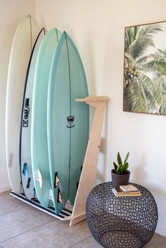 This free standing floor display rack is great for those with a collection of surfboards. Made from beautiful Baltic Birch this rack comes with premium inlaid rubber to protect your rails and thick foam padding to protect your tail. Dimensions: 48" tall, 21" deep. 3 slot is 33" wide. 4 slot is 43" wide. The slots are wide enough to hold boards up to 5" thick.Holds up to 4 Surfboards. Easy assembly. Hassle-free returns.Lifetime warranty. Made in the USA Surfboard Display, Surf Room Decor, Surfboard Storage, Beach Room Decor, Surfboard Rack, Surf Room, Beachy Room, 타이포그래피 포스터 디자인, Beach Room