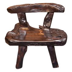 a wooden chair that is made out of wood and has been carved to look like an animal