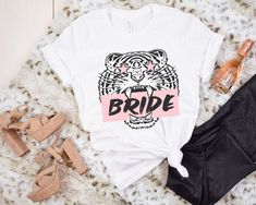 Bachelorette Party Shirts, Last Rumble in the Jungle, Bach T-Shirts, Bride and Babes Tees, Retro Bride, Cute Bach Party Tshirts, Bridal Party T Shirt, Tiger Exotic Party, Cats Kittens Funny, Retro Brides Attire, Bach Party Favors, Funny Team Bride, Matching Group Shirts, Girls Trip Shirt Links to the Babes Shirts: White: www.etsy.com/listing/1008295003/bachelorette-party-shirts-last-rumble-in Gray: www.etsy.com/listing/1008300371/bachelorette-party-shirts-last-rumble-in Use code 20OFF3 for 20% o White Graphic Print T-shirt For Bachelorette Party, White Short Sleeve T-shirt For Party Season, White Graphic Print Shirt For Bachelorette Party, Last Rumble In The Jungle, Bridesmaids Shirts, Rumble In The Jungle, Bride Attire, Retro Bride, Babe Shirt