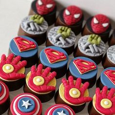 the cupcakes are decorated like superheros