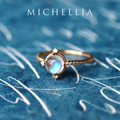 "Our current turnaround time for regular orders is 6-8 weeks. For urgent orders, please shop our Ready-to-Ship collection below (7-10 business days): https://michellia.com/collections/ready-to-ship (please copy and paste into browser) -------- 「Stella」- Aura of Galaxy Ring, in Moonstone Traveled through moons and stars, our galaxy-inspired \"Stella\" is designed to remind us of the infinite possibilities in our incredible universe. The focal iridescent gem is surrounded by four pieces of genuine Crescent Moonstone Ring For Anniversary, Crescent Moonstone Anniversary Ring, Celestial Moonstone Jewelry With Rose Cut Diamonds, Celestial Moonstone Ring For Promise, Celestial Moonstone Promise Ring, Celestial Style Opal Ring, Celestial Crescent Moonstone Ring For Anniversary, Celestial Promise Moonstone Ring, Celestial Moonstone Rings With Rose Cut Diamonds