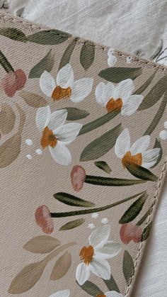 the fabric has been stitched together with flowers on it