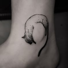 a black and white photo of a person's foot with a banana on it