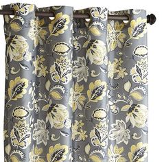 a curtain with yellow and gray flowers on it