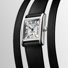 The Mini DolceVita is a masterpiece that exquisitely expresses Longines’ quiet luxury and contemporary elegance. 21.5 x 29mm rectangular stainless steel case Silver-tone "flinqué" dial with blue hands and painted Roman numerals Scratch-resistant sapphire crystal Swiss quartz movement Black leather strap with buckle clasp Water-resistant to 30 meters Caliber L178 Classic Square Watch For Formal Occasions, Classic Square Watches For Formal Occasions, Classic Square Formal Watches, Timeless Rectangular Watch, Classic White Gold Everyday Luxury Watch, Timeless Rectangular Watch With Polished Finish, Luxury Square Watches For Formal Occasions, Luxury Square Formal Watches, Elegant Rectangular Watches For Anniversary