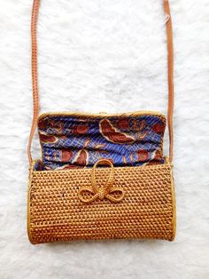 All of our rattan, ata and straw bags are handmade and therefore some bags may have slight variations in design, size, colour and hardware/ fastenings. This is a natural occurrence in handcrafted goods. Due to the handcrafted nature, no two designs will be exactly alike. Rectangular Rattan Bag With Adjustable Strap, Rectangular Brown Rattan Straw Bag, Brown Rattan Straw Bag With Adjustable Strap, Everyday Brown Rattan Bag, Brown Crossbody Straw Bag With Bamboo Handle, Handmade Rattan Shoulder Bag For Daily Use, Brown Rattan Shoulder Bag For Daily Use, Daily Use Handmade Rattan Shoulder Bag, Traditional Natural Woven Leather Shoulder Bag