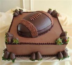 a football themed cake with chocolate frosting