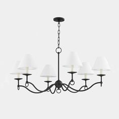 a black chandelier with white shades hanging from it's center point and four lights on each side