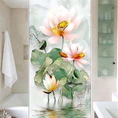 a bathroom with a glass shower door decorated with water lilies and dragonflys