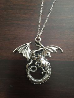 dragon, dragon necklace, dragon jewelry, silver dragon, silver dragon necklace, dragon pendant, silver necklace, necklace ★ Total Chain Length: 18 inches ★ Pendant Size: 43 mm x 46 mm This necklace is also available in gold: https://www.etsy.com/listing/251459116/dragon-dragon-necklace-dragon-jewelry?ref=shop_home_active_1 ★ Want to see more? Please click on: kmsupplies.etsy.com 26 Whale Jewelry, Whale Tail Necklace, Football Jewelry, Football Necklace, Necklace Dragon, Africa Earrings, Whale Necklace, Fox Jewelry, Foxes Necklace