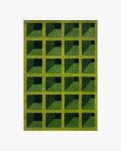 an abstract green rug with squares and rectangles