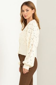 This cardigan is designed to make your days even more delightful. The exquisite pointelle knit detail adorns the entire piece, adding a touch of intricate charm. The button-front bodice exudes timeless elegance and is framed by a classic V-neckline that flatters your neckline. The ribbed cuffs and hem provide a finishing touch, enhancing the overall texture and fit of the cardigan. Model is wearing a smallModel SpecsHeight: 5'9"Bust: 34"Waist: 24"Hips: 35" Fabric Contents: 79% Polyester 21% Acry Classic Pointelle Knit Cardigan For Fall, Chic Pointelle Knit Cardigan For Layering, Feminine Pointelle Knit Cardigan For Fall, Elegant Pointelle Knit Cardigan For Spring, Elegant Pointelle Knit Spring Cardigan, Elegant Cable Knit Sweater For Spring, Elegant Open Knit Sweater For Spring, Feminine Spring Cardigan With Pointelle Knit, Classic Pointelle Knit Cardigan