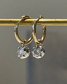 "Lower prices on our main website: https://discomarshmallow.myshopify.com/ A pair of beautiful hoop earrings with round shaped moissanites. In Georgian cut-down settings, the round moissanite Hoop earrings are handcrafted in white and yellow gold, on small yellow gold hoops.  Item Details * Made to Order. * Gold Kt: 14K or 18K Solid Gold * Custom Gold Color: Rose Gold, Yellow Gold, White Gold * Cut: Round * Setting Type: Georgian * Ready to Ship in 20-30 business days If you are interested in a Brilliant Cut Dangle Hoop Earrings As Gift, Anniversary Dangle Huggie Earrings With Brilliant Cut, Dangle Hoop Earrings With Brilliant Cut For Gift, Diamond White Cubic Zirconia Hoop Earrings With Single Diamond, Diamond Cut Dangle Huggie Earrings For Anniversary, Dainty Diamond-white Round Hoop Earrings, Classic Round Hoop Earrings With Single Diamond, Classic Round Huggie Earrings With Single Diamond, Dainty Diamond White Hoop Earrings