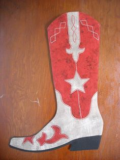 the cowboy boot is painted red and white