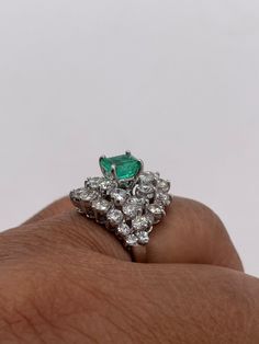 Stunningly gorgeous, Emerald & Diamond Ring set in Platinum. Handmade. Beautiful quality piece of jewelry. Approximately 2.20 ct. in Diamonds, Emerald is nice color & measures 1.15 ct. Diameter of ring is 19mm, size 6 but can be sized. Circa 1950's Gia Certified Trillion Cut Emerald Wedding Ring, Luxury Trillion Cut Emerald Ring For Formal Occasions, Luxury Trillion Cut Diamond Emerald Ring, Cluster Green Emerald Ring In Platinum, Green Emerald Cluster Ring In Platinum, Luxury Trillion Cut Emerald Diamond Ring, Green Platinum Emerald Ring With Cluster Shape, Platinum Cluster Emerald Ring, Luxury Gia Certified Trillion Cut Emerald Ring