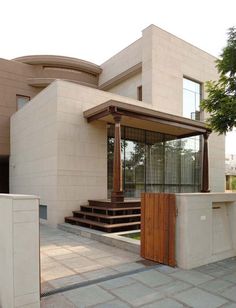 a modern house with stairs leading up to it