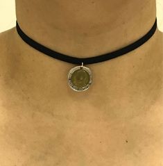 Black velvet adjustable choker with Kenia 5 Shillings Coin Depending in the availability of the coins we can do bracelets, earrings, necklaces and pendants for most any of the coins we have listed for sale on here. We do not clean any coins and we polish very, very few as we want to leave all of the character on each coin. Each coin tells its own story and because of the character on each coin, no two coins will be identical. Will be adding many more cut coin, coin jewelry, and coin accessory it Adjustable Coin Pendant Jewelry, Silver Adjustable Choker With Round Pendant, Adjustable Black Medallion Jewelry, Adjustable Metal Choker, Silver Coin Pendant Choker, Nickel Free Metal Choker, Adjustable Metal Coin Necklace For Gifts, Adjustable Nickel-free Round Choker, Vintage Round Adjustable Choker