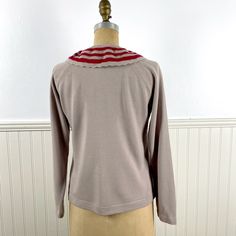 Vintage sweater with sailor collar and raglan sleeves, cafe au lait with red stripes in the collar. By Talbot - size 36. Material / 100% Orlon acrylic Care / Machine wash cold, tumble dry warm Suggested modern size S Measurements (taken flat then doubled) Armpit to armpit 38" Waist 40" Sleeve, armpit to hem 14" Shoulder to shoulder 15" Shoulder to hem 21" CONDITION Very good. Minor pilling. This is a vintage item. It has been used and loved and it has a history. Please examine photos carefully a Winter Sweater With Striped Collar And Crew Neck, Winter Crew Neck Sweater With Striped Collar, Winter Sweater With Striped Collar, Winter Knit Sweater With Striped Collar, Sailor Collar, Vintage Sweater, Vintage Sweaters, Round Collar, Raglan Sleeve