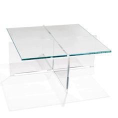 a glass coffee table with two legs on top of each side and one end at the base