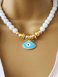 White Onyx Evil Eye Necklace , white and gold one of a kind evil eye necklace ,gift for her 10 mm onyx bead with gold filled beads. 16 inch long with 3 inch chain at the back White Evil Eye Beaded Necklace, White Beaded Amulet Necklace, Handmade White Amulet Jewelry, Spiritual White Beaded Pendant Necklace, White Evil Eye Jewelry Gift, White Beaded Amulet Jewelry, Handmade White Amulet Necklace, White Handmade Round Charm Necklaces, White Round Handmade Charm Necklace