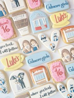 decorated cookies are displayed on a table