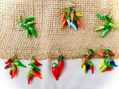 Beautifully crafted glass bead chile earrings in an assortment of the ristra's natural changing colors! In New Mexico we love our chile! Not only to eat, but to adorn our homes with and now to wear fashionably as jewelry! Earrings Etsy, Glass Bead, New Mexico, And Now, Beautiful Design, Jewelry Earrings Dangle, Etsy App, Selling On Etsy, Sell On Etsy