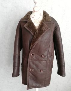 "Vintage Brown Double Buttoned Real Shearling Sheepskin Leather Casual Coat Men Outside of the jacket it is leather finish, and on the inside, there is a very smooth, supple, and warm thick sheepskin wool PETROFF Real Sheepskin Winter Brown Coat Men's genuine hip length sheepskin jacket It has a three button fastening, a notched collar, 2 outer pockets. This winter sheepskin coat is warm and soft. * PETROFF * Size on tag: Medium Approx fit Small ( Maneken size is M) * Genuine Sheepskin Leather * Leather Fur Coat With Faux Fur Lining, Brown Leather Jacket With Leather Lining For Winter, Brown Rugged Sheepskin Leather Jacket, Brown Leather Long Fur Coat, Vintage Leather Fur Coat With Faux Fur Lining, Classic Long Leather Fur Coat, Brown Leather Jacket With Faux Fur Lining, Brown Sheepskin Leather Jacket With Long Sleeves, Brown Long Sleeve Sheepskin Leather Jacket