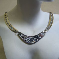 This handsome multi piece necklace features the incredible work of the Mexican metalsmiths. It is made of alpaca metal which looks like silver and wears like iron. The metal is an alloy with zinc, copper and sometimes nickel. The inlay work is lustrous pieces of abalone shell which are the color of a stormy sky but radiate colors of blue, green and pink. The background is white enamel in the metal which makes this a perfect spring or summer necklace. The necklace measures 17 inches long and each Unique Silver Etched Necklaces, Artistic Engraved Silver Necklaces, Artisan Silver Etched Necklace, Artisan Silver Engraved Necklaces, Unique Engraved Metal Jewelry, Artisan Metal Jewelry With Etched Details, Artistic Nickel-free Silver Necklaces, Artistic Oxidized Silver Necklace, Artisan Etched Metal Jewelry