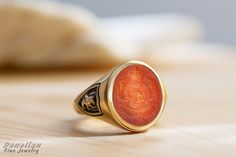 ✪ Carnelian Engraved Family Crest Signet Ring - Personalized Coat of Arms - Danelian Jewellery Workshop ✪ Danelian Jewellery with fine goldsmiths craftsmanship creates custom designs based on our client requests. Gold rings made with personalized specifications, your family crest, coat of arms, logo or any design imagined. ➤ Large variety of gemstones to create, with personalized engraving. ✔ Feeling inspired? Leave us your message to discuss now and see any bespoke jewelry brought to life. ♠ Ou Anniversary Carnelian Signet Ring With Polished Finish, Yellow Gold Carnelian Signet Ring Gift, Yellow Gold Carnelian Signet Ring As A Gift, Gift Carnelian Signet Ring In Yellow Gold, Gift Carnelian Yellow Gold Signet Ring, Carnelian Signet Ring For Anniversary, Carnelian Signet Ring With Polished Finish, Family Crest Ring, Family Crest Rings