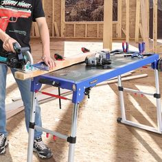 a man is working on a table sawing