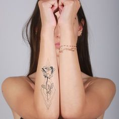 a woman with tattoos on her arms