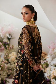 Kameez Trouser Dupatta Black Pakistani Wedding Dress is a breathtaking attire adorned with Zardsoi, Dabka, Floral designs, and Goldwork. Fast Shipping. Wedding Long Sleeve Sharara With Gold Embroidery, Eid Salwar Kameez With Gold Embroidery In Georgette, Eid Reception Dress With Gold Embroidery, Gold Dabka Dress For Reception, Gold Dabka Reception Dress, Gold Dabka Dress For Designer Wear, Gold Dresses With Dabka For Designer Wear, Black Gown With Dabka Work For Reception, Bollywood Style Dress With Gold Embroidery For Reception