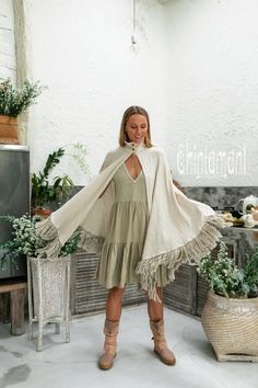 Spring Vacation Bohemian Shawl, Bohemian Cream Poncho With Fringe, Cream Bohemian Poncho For Fall, Beige Bohemian Shawl Poncho, Bohemian Summer Cape Shawl, Bohemian Beige Shawl For Spring, Bohemian Beige Wrap Shawl, Bohemian Cape Shawl For Summer, Bohemian Spring Shawl With Tassels