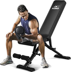 a man is sitting on a bench with his legs crossed and holding a weight machine