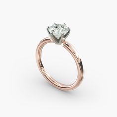 a rose gold engagement ring with a single diamond in the center, on a white background