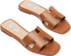 Trendy Brown Slip-on Slides, Modern Brown Slides For Vacation, Trendy Brown Flat Slides, Trendy Brown Leather Slides, Brown Spring Slides, Brown Slides For Spring, Modern Brown Flat Slides, Brown Slides With Branded Insole, Chic Brown Slide Sandals