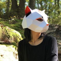 a woman wearing a paper mask in the woods