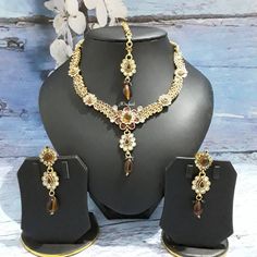 This beautiful ethnic kundan gold plated enamel work necklace  set is a unique classic jewellery set which will add a graceful look to your wedding dress. Studded with kundan pearl stones. Dazzle the wedding by wearing this look set. Statement necklace will come with matching earrings and tikka. Necklace with adjustable necklace cord to adjust the length of the necklace. Earrings Size:  L x 6cm / W x 1.6cm Stone Colour: Clear Whit, Brown Main Colour: Gold Gold Kundan Necklace With Elegant Design, Gold Meenakari Jewelry Sets, Bollywood Style Metal Kundan Necklace As Gift, Gold Meenakari Bridal Sets As Gift, Gold Meenakari Bridal Sets For Gift, Gold Meenakari Tikka For Gift, Gold Kundan Bollywood Style Necklace, Bollywood Style Gold Jeweled Jewelry Sets, Bollywood Style Gold Metal Jewelry Sets