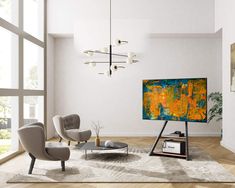 a living room filled with furniture and a large painting on the wall