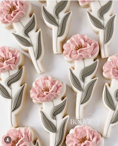 decorated cookies with pink flowers on them