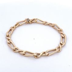 "14Kt Yellow Gold Figure Eight Curb Link Bracelet Open Link =Made in Italy. 7.75\" long with a box clasp with figure eight for safety Metal Content: 14Kt Gold Clasp: Box with figure 8 safety Measurements Length: 7.75\" Width: 1/4\" (7mm) Weight: 7.6 Grams Marked: 14kt Italy Condition: Excellent Each piece is thoroughly examined and refinished as needed by our professional jewelers, tested to guarantee metal content, graded by our in-house GIA (Gemological Institute of America) Graduate Gemologis Luxury Figaro Chain Bracelet For Formal Occasions, Formal Gold Bracelet With Links, Formal Box Chain Bracelet With Oval Links, Formal Gold Chain Bracelet With Hook And Links, Modern Formal Bracelets With Figaro Chain, Elegant Gold Chain Bracelet With Hooks And Links, Formal Chain Link Bracelet With Hook And Links, Elegant Formal Bracelet With Figaro Chain, Modern Formal Figaro Chain Bracelets