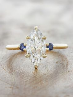 caption:1.40ct marquise diamond Engagement Ring With Hidden Halo, Sapphire Side Stones, Peach Sapphire, Lab Diamond Engagement Ring, Sapphire Wedding, Marquise Cut Diamond, Three Stone Engagement, Yellow Gold Setting, Three Stone Engagement Rings