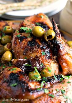 chicken with olives and parsley on the side