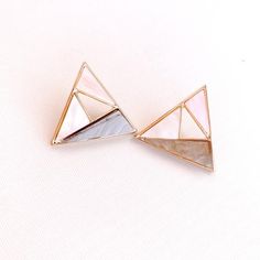 Geometric Stud Earrings Colorful Hollow Triangle Earrings Round Post Earrings Square EarringsThese colorful Geometric Stud Earrings will be your favorite go to everyday earrings and look great day or evening!• Approximate size: 2" Wide x 2"Long* Comes wrapped in a cute little gift box. Ready for gift giving. :)* All products are Lead and Cadmium Free & Nickel Safe* Care Instructions *• Limit exposure to water, hairspray, lotion, makeup, etc. • Gently clean with a jewelry polishing cloth and Triangle Metal Earrings For Gift, Multicolor Geometric Earrings For Gift, Geometric Multicolor Earrings For Gift, Geometric Multicolor Earrings As Gift, White Triangle Earrings For Gift, Triangle Shaped Single Earring As A Gift, Triangle Single Earring As Gift, Pink Geometric Earrings, Trendy Geometric Earrings For Gifts